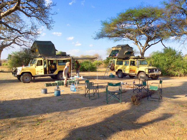 Safari Vehicles Setting up Camp